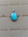 Sterling Silver Oblong Synthetic Turquoise Pendant With Braided Bezel