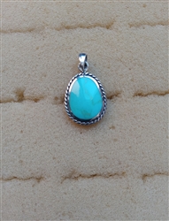 Sterling Silver Oblong Synthetic Turquoise Pendant With Braided Bezel